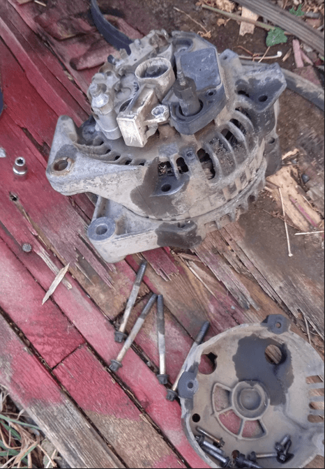 Rear housing of the Delco Remy alternator showing electrical contacts