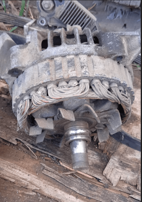 Removing the long through-bolts to split the alternator case halves
